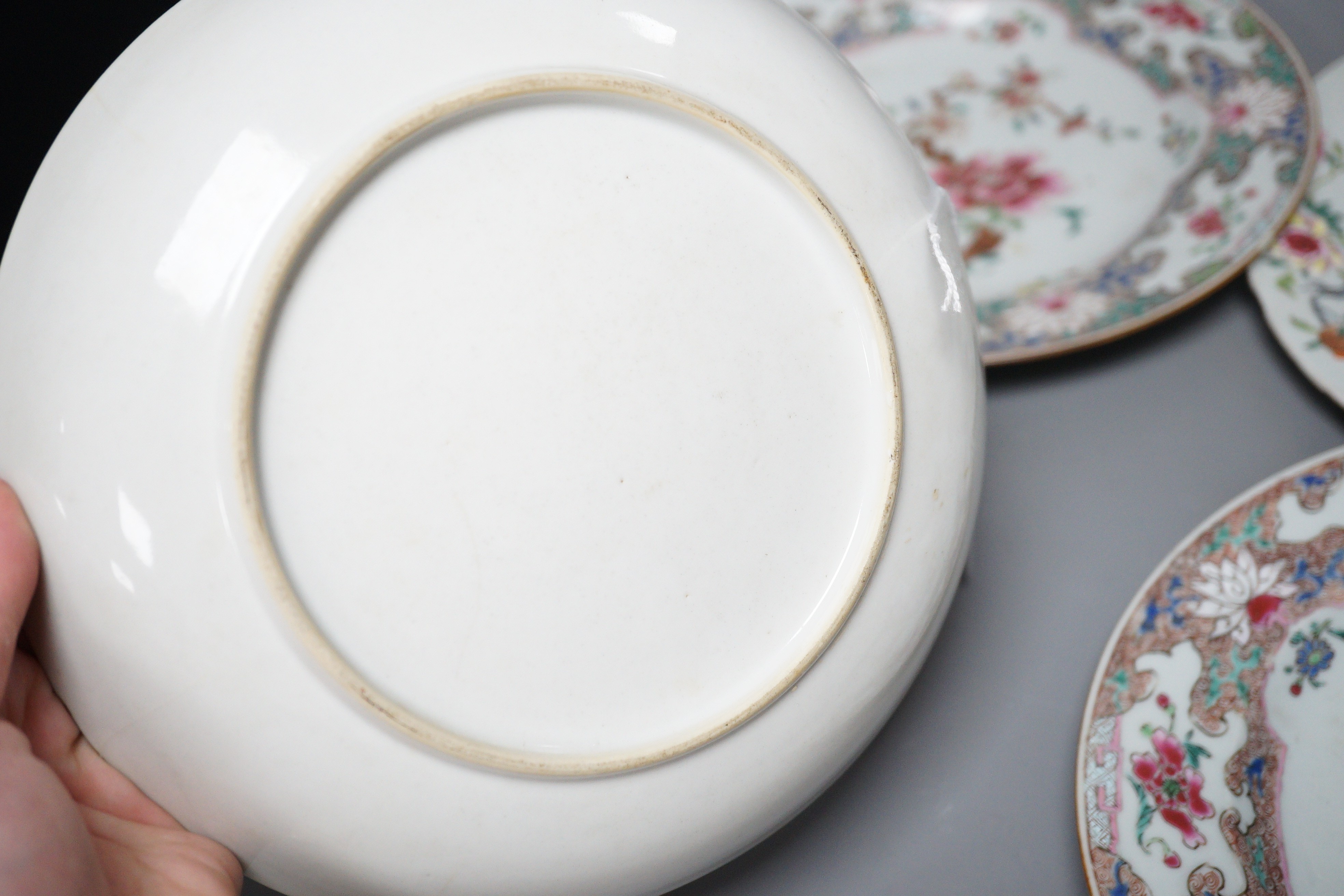 A pair of 18th century Chinese export famille rose plates and two others, largest 23cm